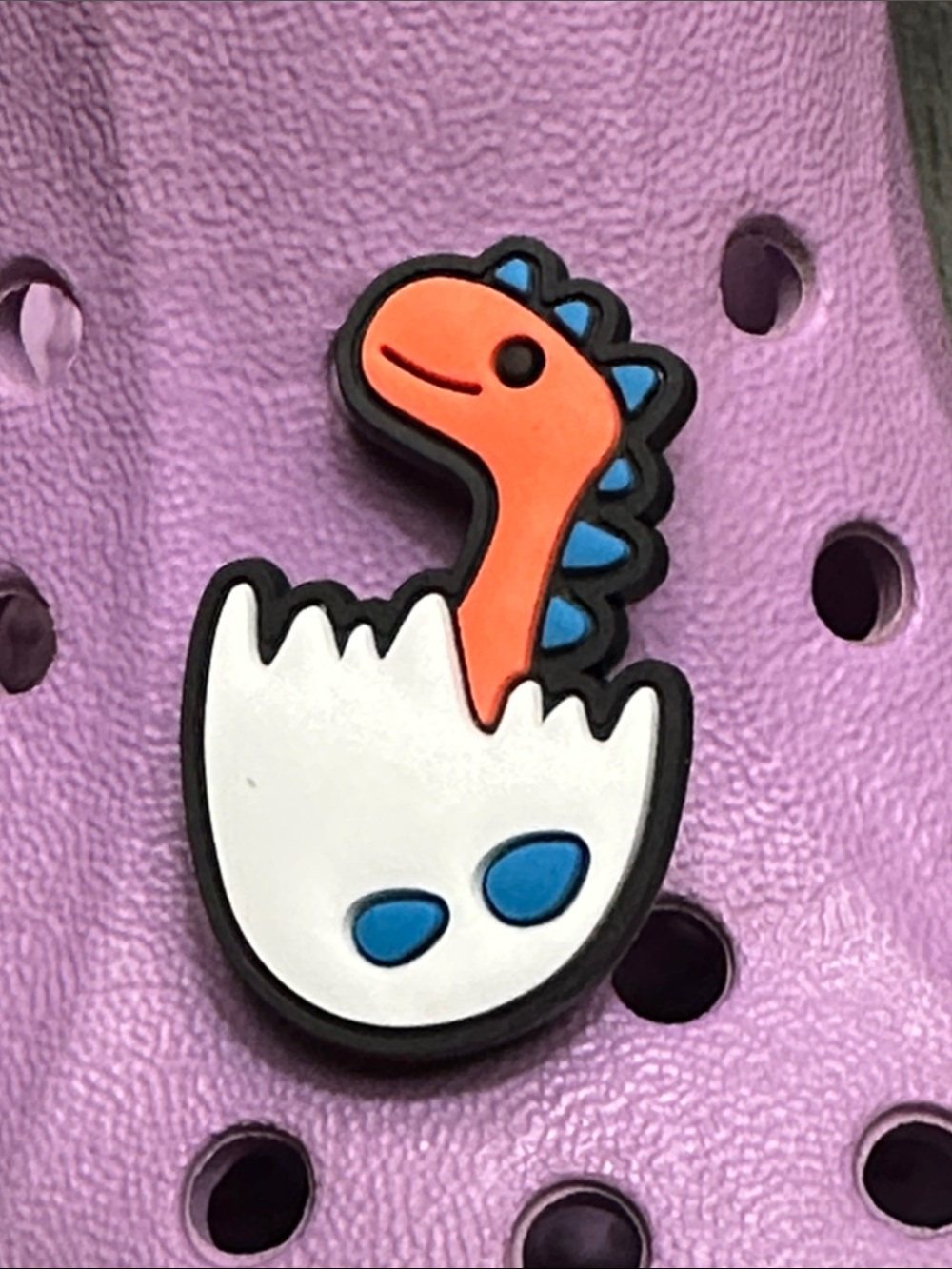 Jibbitz Orange Dinosaur in White Egg Shoe Charm with Blue Accents